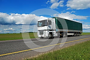 White lorry with green trailer