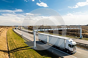 White lorry passing toll gate on Prague Circuit, Czech republic