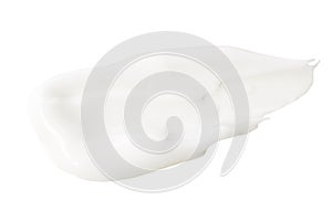 White lotion swatch isolated on white. Cosmetic liquid cream texture. Skin care product macro