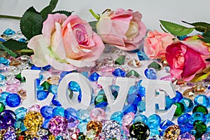 White love letter inside colorful diamonds. photo