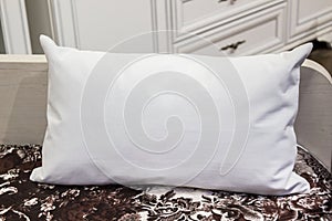 White lumbar pillow on a bed, case Mockup. Interior photo