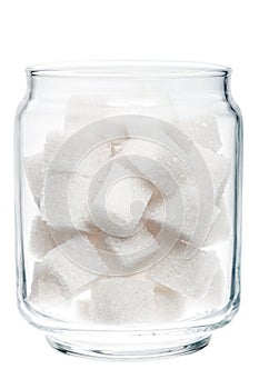 White lump sugar in a glass jar.