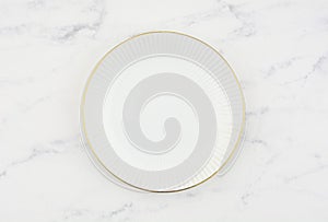 White luxury plate on white marble