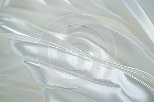 White luxury satin fabric waves background. Rippled white silk fabric satin cloth waves glamour background. Use for cosmetic store