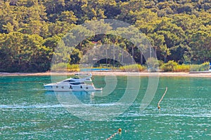 White luxury yacht sailing in the Mediterranean sea in Kemer, Antalya province, Turkey