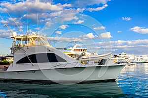 White luxury yacht in a sea harbor of Hurghada, Egypt. Marina with tourist boats on Red Sea