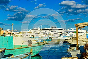 White luxury yachts in a sea harbor of Hurghada, Egypt. Marina with tourist boats on Red Sea
