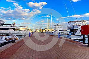 White luxury yachts in a sea harbor of Hurghada, Egypt. Marina with tourist boats on Red Sea