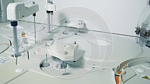 White machine works with samples in laboratory.