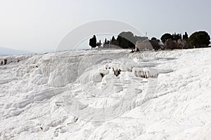 White magic in Pamukkale - limestone travertine formations pools with mineral water from hot springs