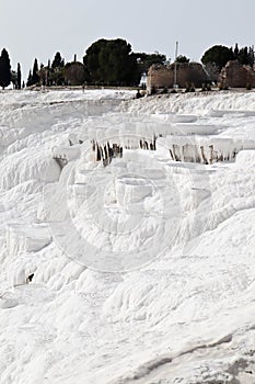 White magic in Pamukkale - limestone travertine formations pools with mineral water from hot springs