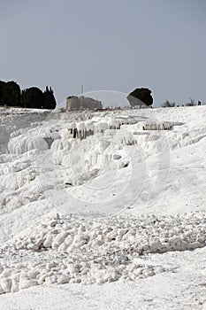 White magic in Pamukkale - limestone travertine formations pools with mineral water from hot springs