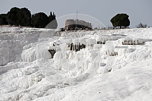 White magic in Pamukkale - limestone travertine formations pools with mineral water from hot springs