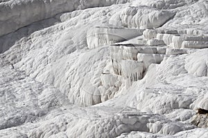 White magic in Pamukkale - limestone travertine formations pools with mineral water from hot springs