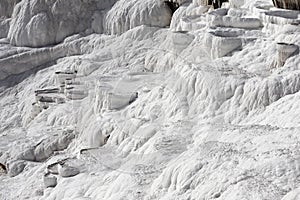 White magic in Pamukkale - limestone travertine formations pools with mineral water from hot springs