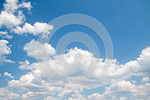 White magnificent cumulus clouds on a blue sky,