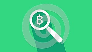 White Magnifying glass with Bitcoin icon isolated on green background. Physical bit coin. Blockchain based secure crypto