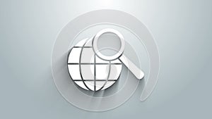 White Magnifying glass with globe icon isolated on grey background. Analyzing the world. Global search sign. 4K Video