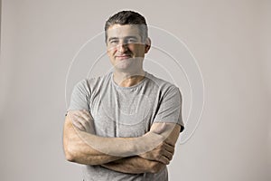 White man 40 to 50 years old smiling happy showing nice and positive face expression isolated on grey background