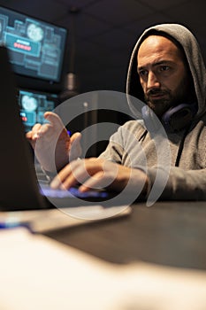 White Male Programmer Typing Secure Code at Night