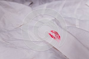 White man clothes stain lipstick mistress. close-up