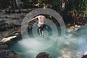 White man enjoying the waterfall