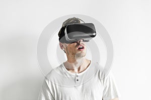 White man experiencing virtual reality with VR headset photo