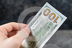 White man hands tear dollars