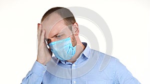 White man in protective mask feeling feeling unwell. Malaise, first symptoms, illness, stress, depression, headache