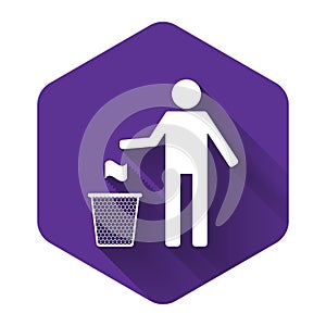 White Man throwing trash into dust bin icon isolated with long shadow. Recycle symbol. Trash can sign. Purple hexagon