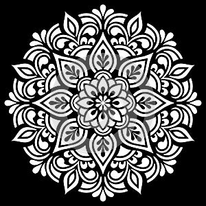 White mandala pattern on black stencil doodles sketch photo