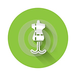 White Mannequin icon isolated with long shadow. Tailor dummy. Green circle button. Vector