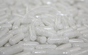 White many blur selective focus capsule tablets light medical background picture