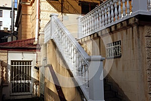 White marble classic staircase and grilles on the windows