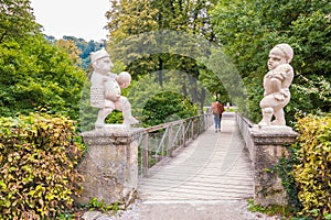 White marble dwarfs at the entrance to the Dwarf Garden Zwerglgarten, Mirabell gardens, Salzburg, Austria