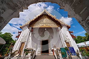 White marble public ancient temple inside arch entrance Wat Phra That Cho Hae, the royal sacred ancient temple photo