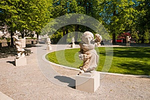 White marble sculptures of dwarfs in the Dwarf Garden Zwerglgarten, Salzburg, Austria photo