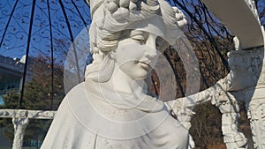 Statue of Greek Goddess Head with lovely hair settled in a public park