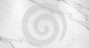 White marble surface featuring subtle grey veining creates a classic, elegant texture.