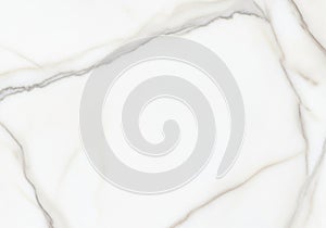 White marble surface featuring subtle grey veining, creating an