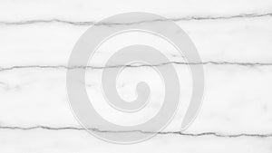 White marble surface with subtle grey veining creating a natural stone texture for backgrounds and