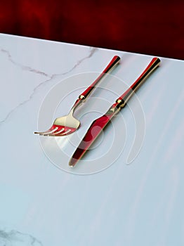 on white marble table and red back