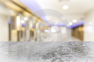 White marble table top on blur coffee shop