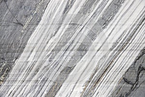 White marble texture in opencast mine. The surface of the marble rock