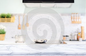White marble texture  table top on blurred kitchen background photo
