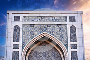 white marble tiles decorated with traditional Uzbek Islamic pattern ornament on the wall Minor Mosque in Tashkent in