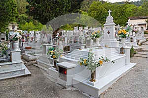 White marble tombstones at the cemetery by the Holy Virgin Church in Panagia, Thassos Island, Greece