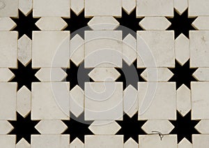 White marble wall with star shape cut-outs. India