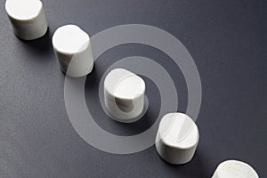 White marshmellow on dark background