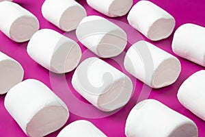 White marshmellow on pink background